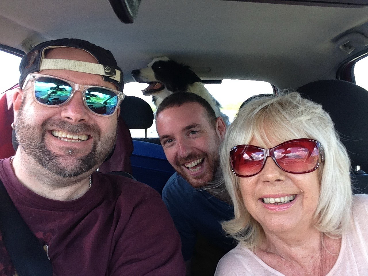 A photo of Rob, me and his mom in the car, taking the dogs on an adventure.